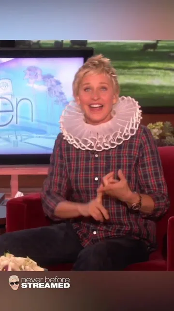 An Ellen Show short of Ellen DeGeneres in a ruff collar holding a Shake Weight